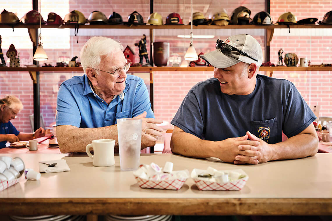 Titus Brown and Chris Holcomb at the counter at Barry's Cafe