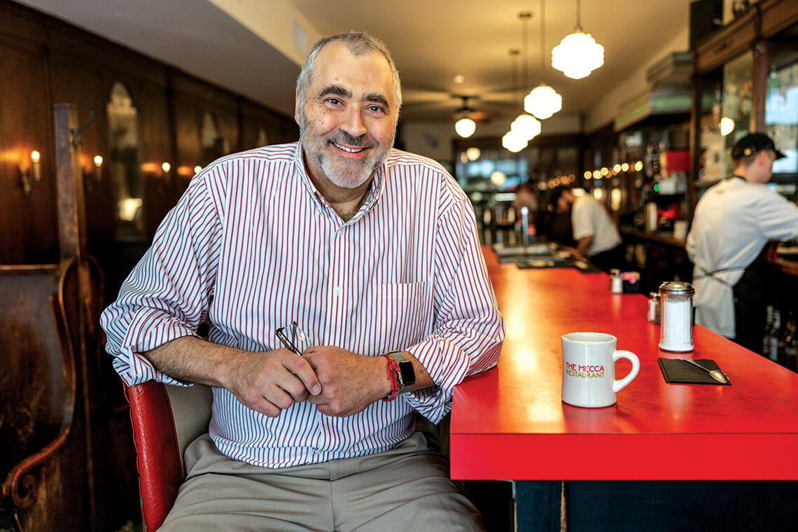 Greg Hatem at the counter at The Mecca