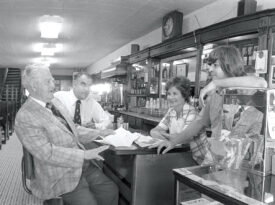 Black and white photo of patrons at The Mecca in Raleigh