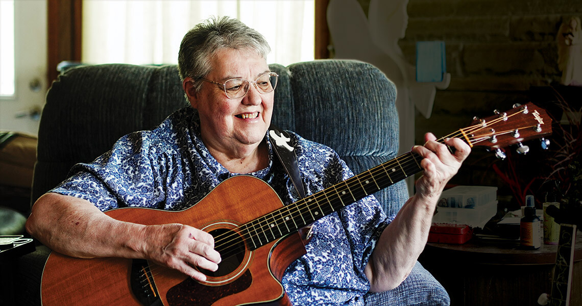 Rhonda Gouge plays the guitar