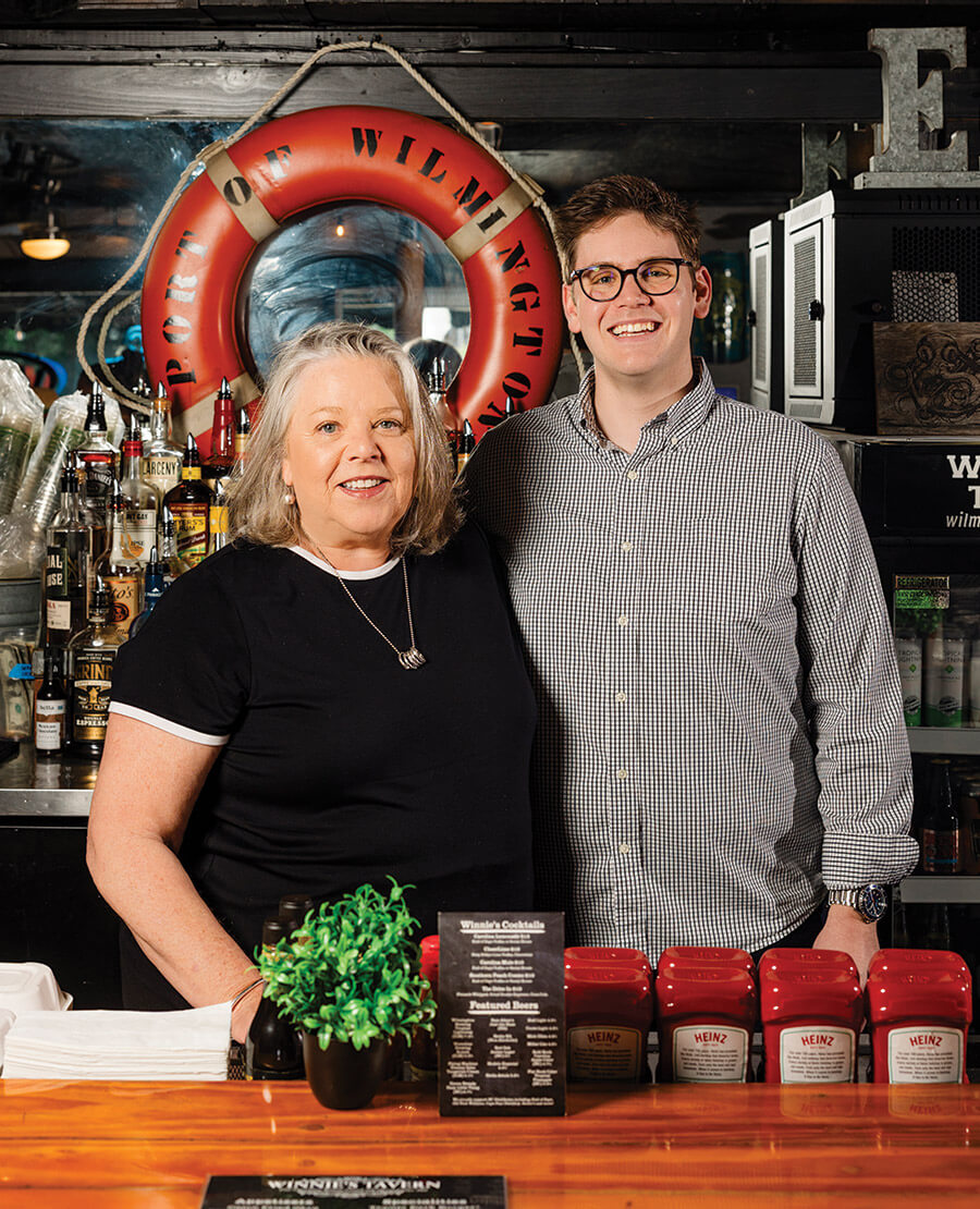 Owner Wendy Fincher-Hughes and her son Owen inside Winnies