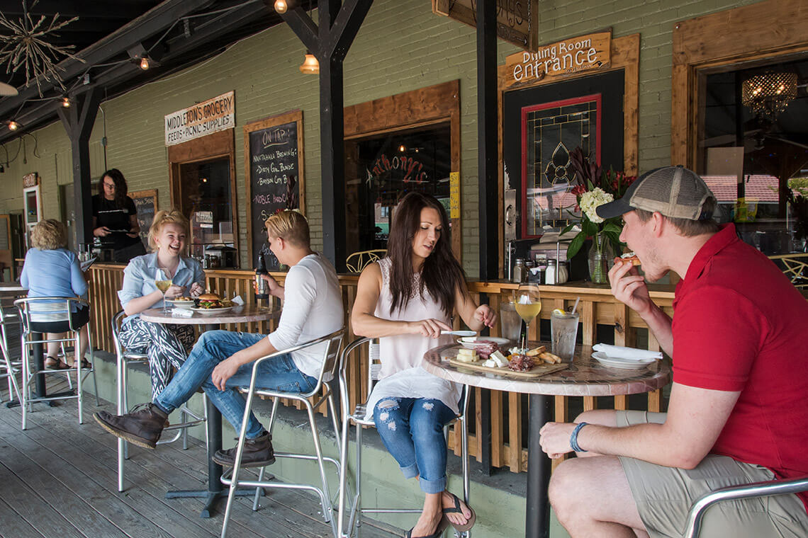 Couples dine on the porch of Anthony's Restaurant
