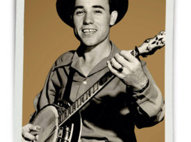 Photo of young Earl Scruggs with a banjo