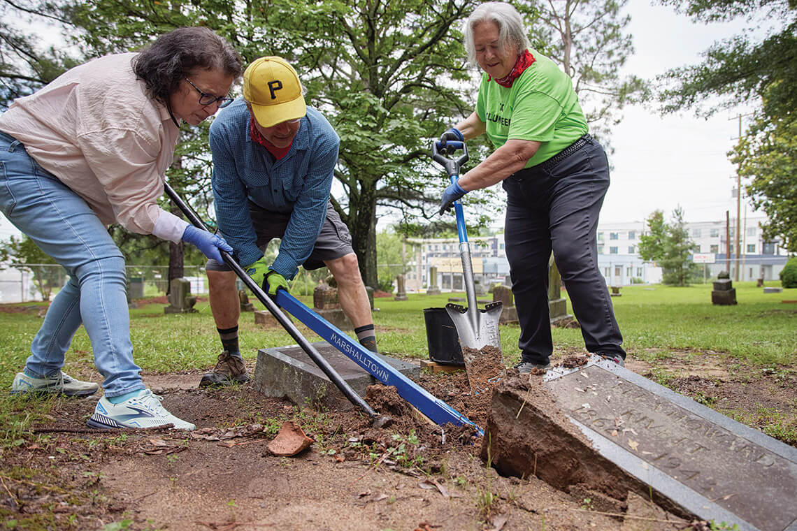 David Craft and volunteers complete preservation work on a gravesite