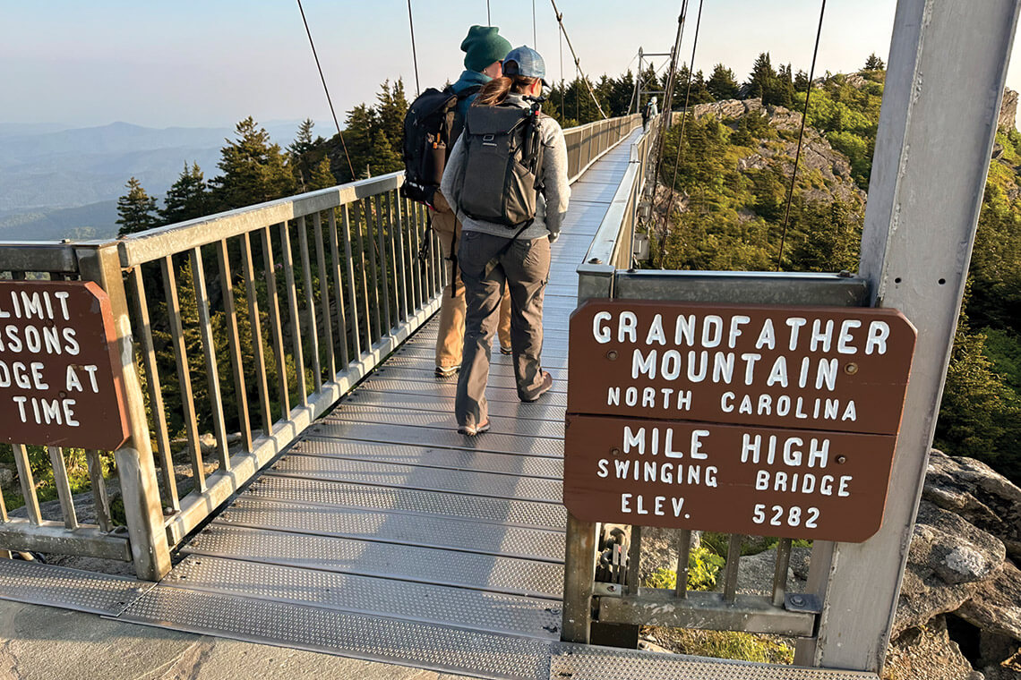 Hikers crossing the Mile-High Swinging Bridge at Grandfather Mountain