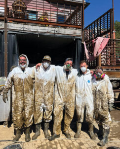 Volunteers clearing mud from basements and businesses in Marshall, NC