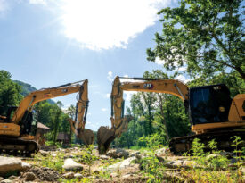 Excavators clearing debris after Hurricane Helene
