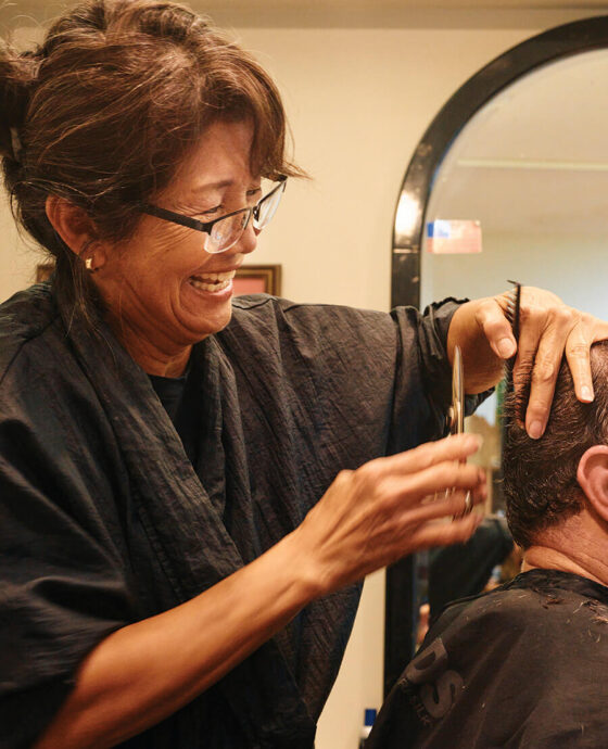 Mai McLean cutting to hair