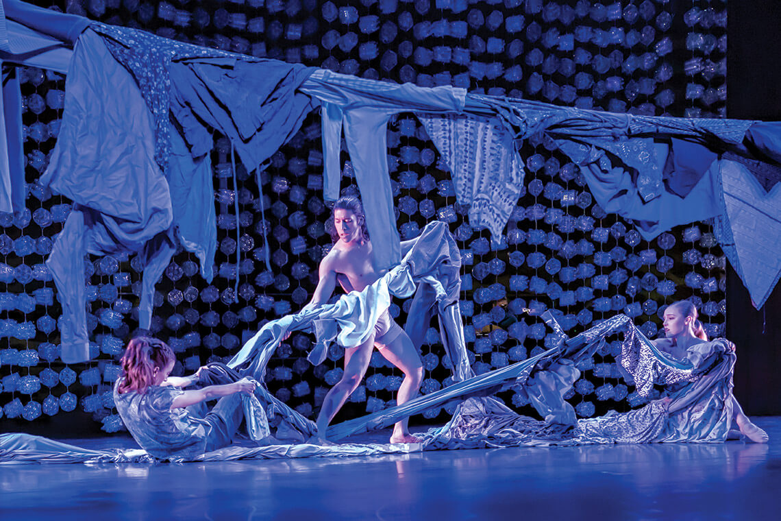 Dancers perform with blue cloth to symbolize floodwaters in Appalachian Phoenix