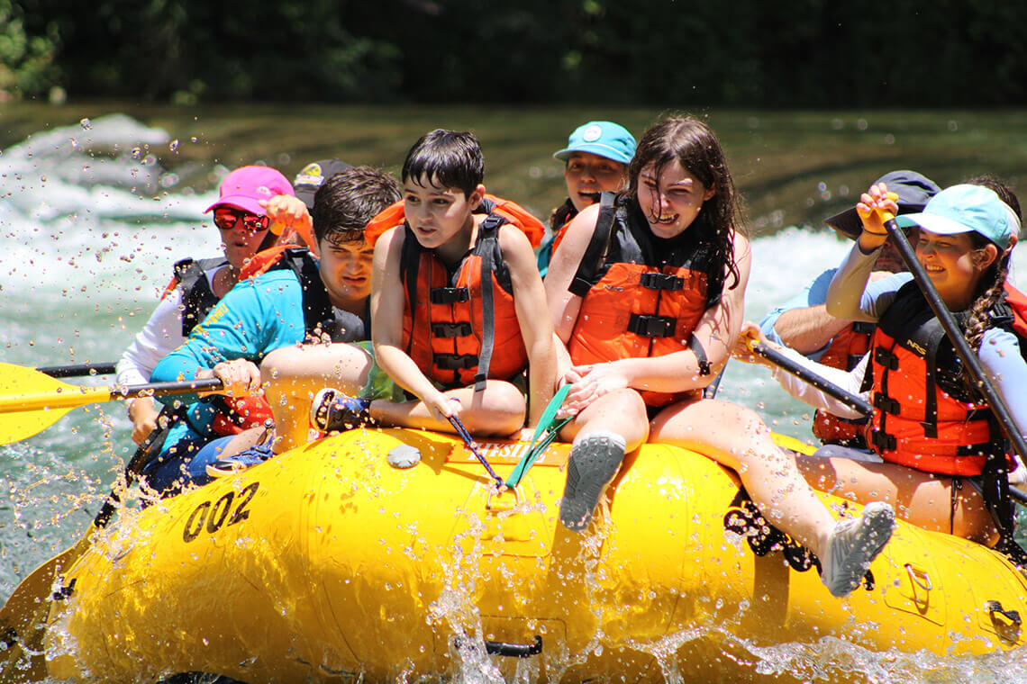 People whitewater rafting in the Watauga River