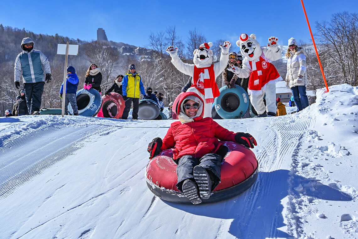 Person on inner tube at Sugar Mountain