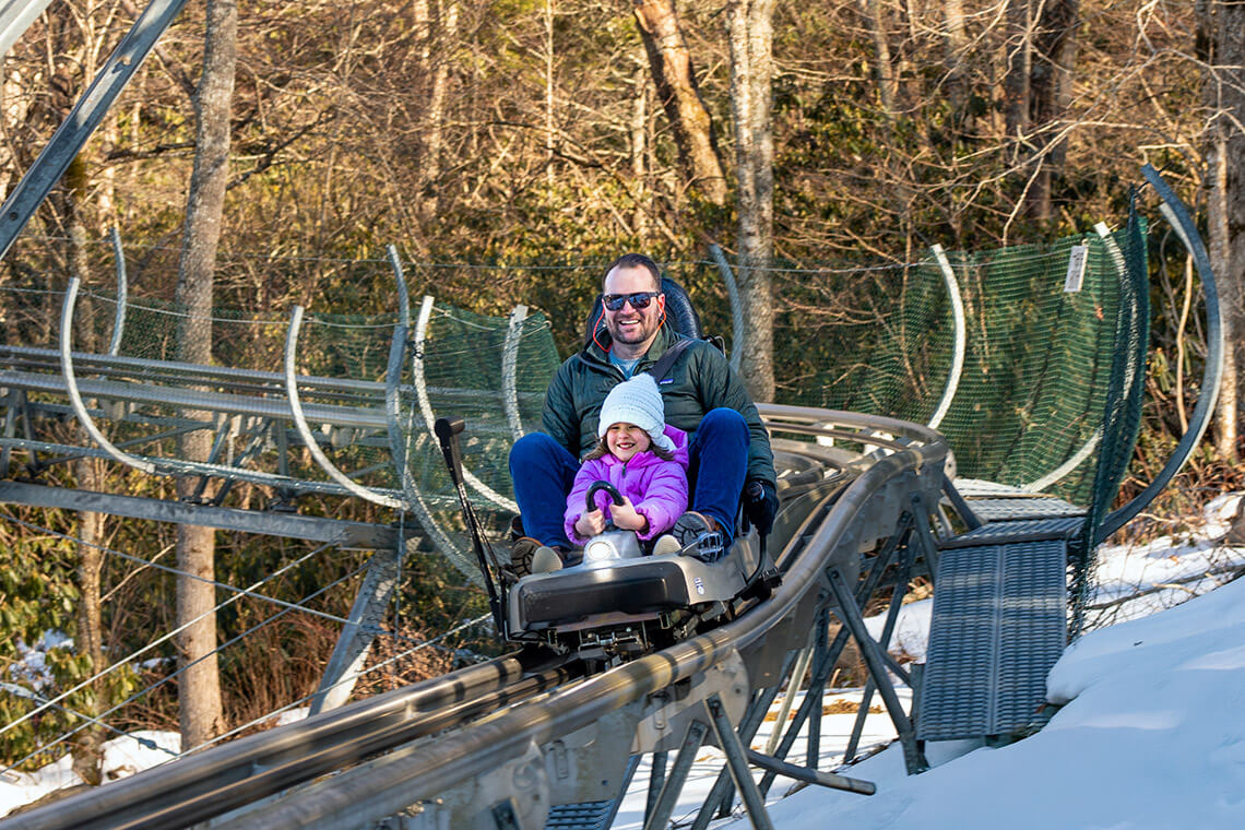 Father and child on the Wilderness Run Alpine Coaster