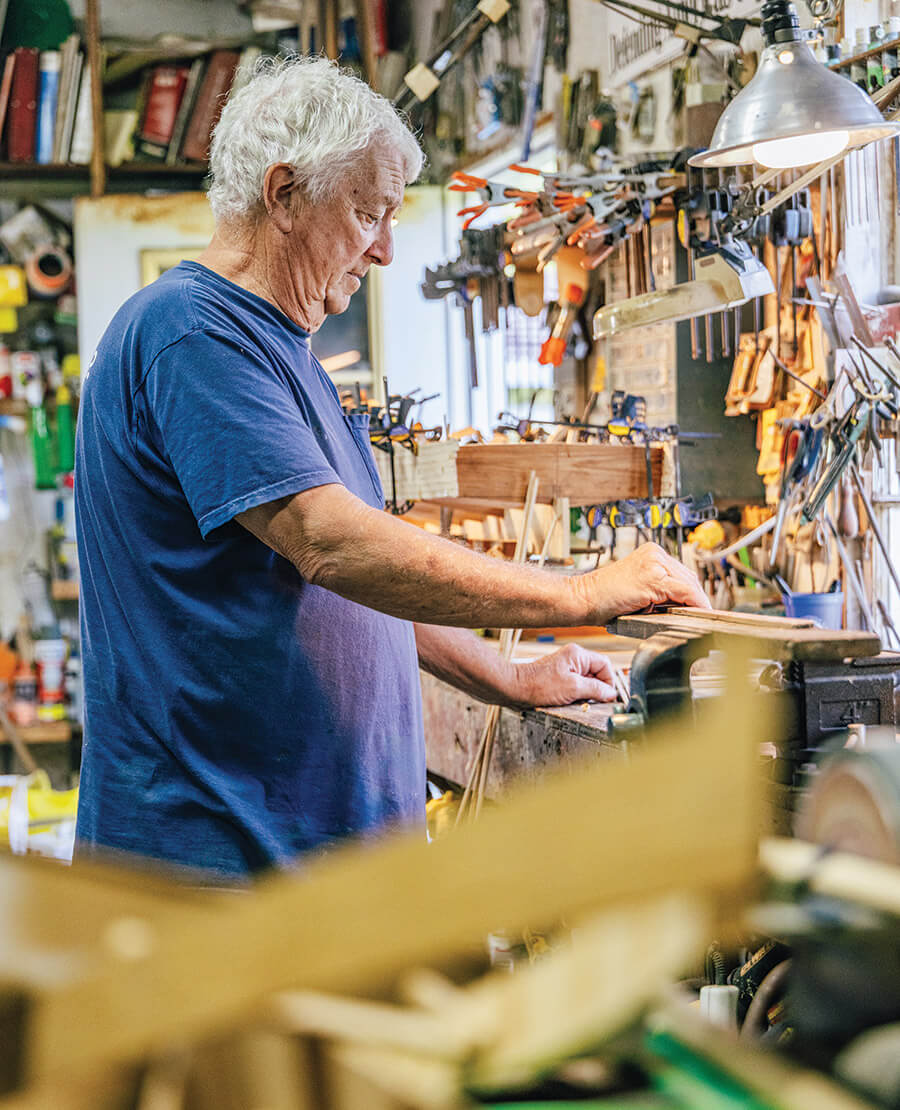 Jimmy Amspacher building a boat in his workshop