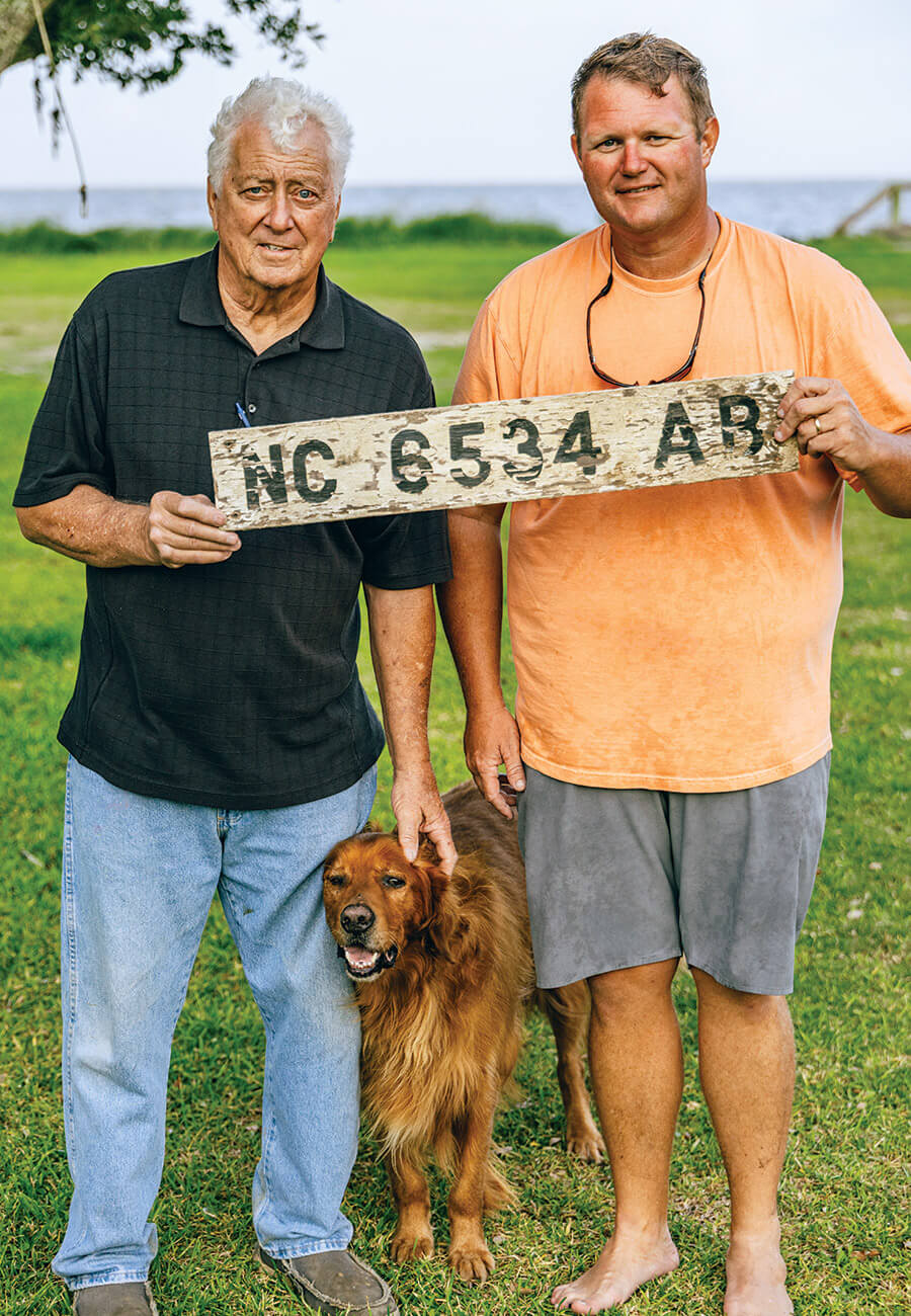 Jimmy Amspacher and Timothy Fulcher with the nameplate from their earlier boat