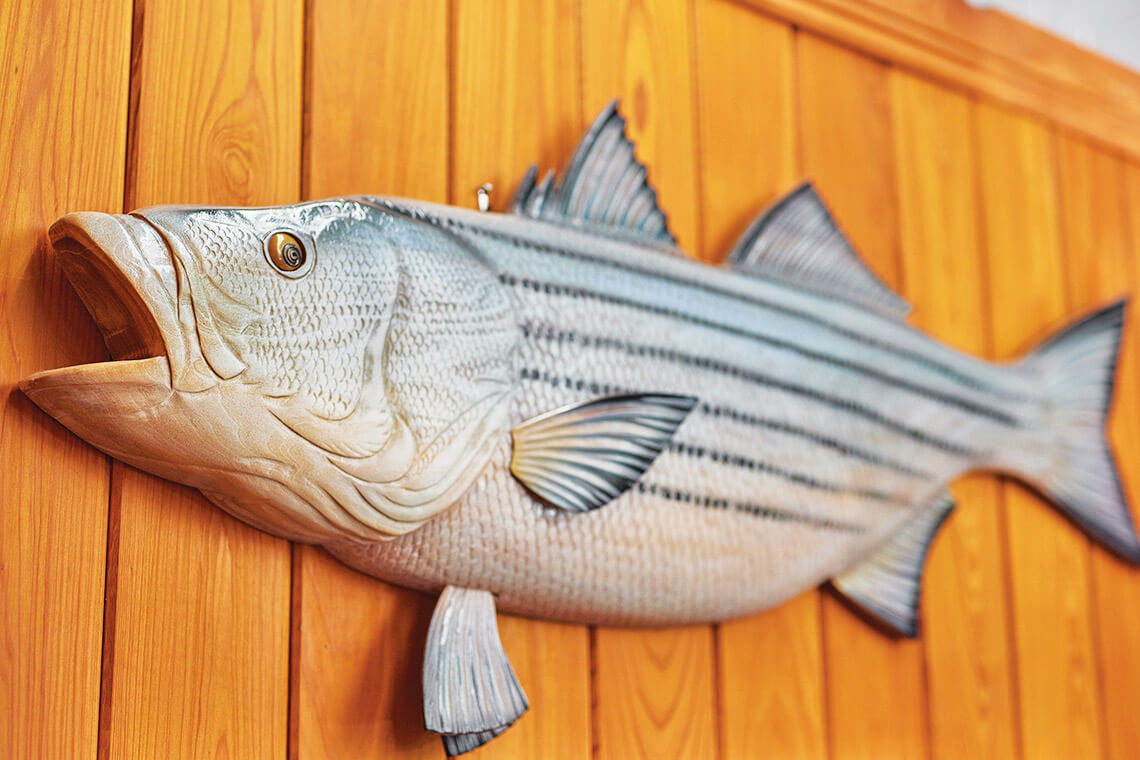 Wooden fish hanging on a wall