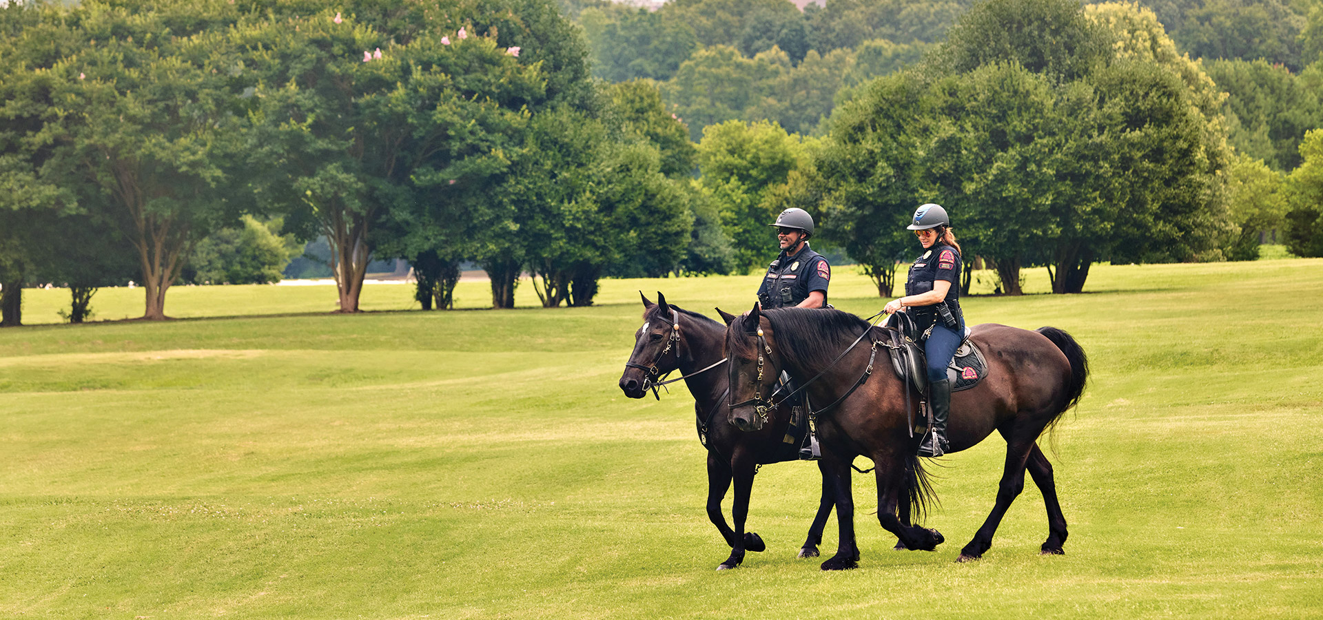 Two officers in the Raleigh Police Department's Mounted Unit in Dix Park