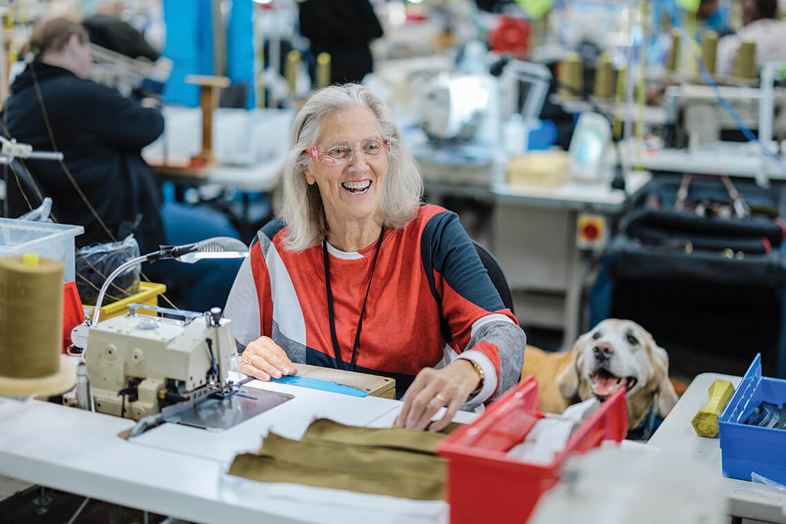 Lynn Drake at work with her dog Kenny