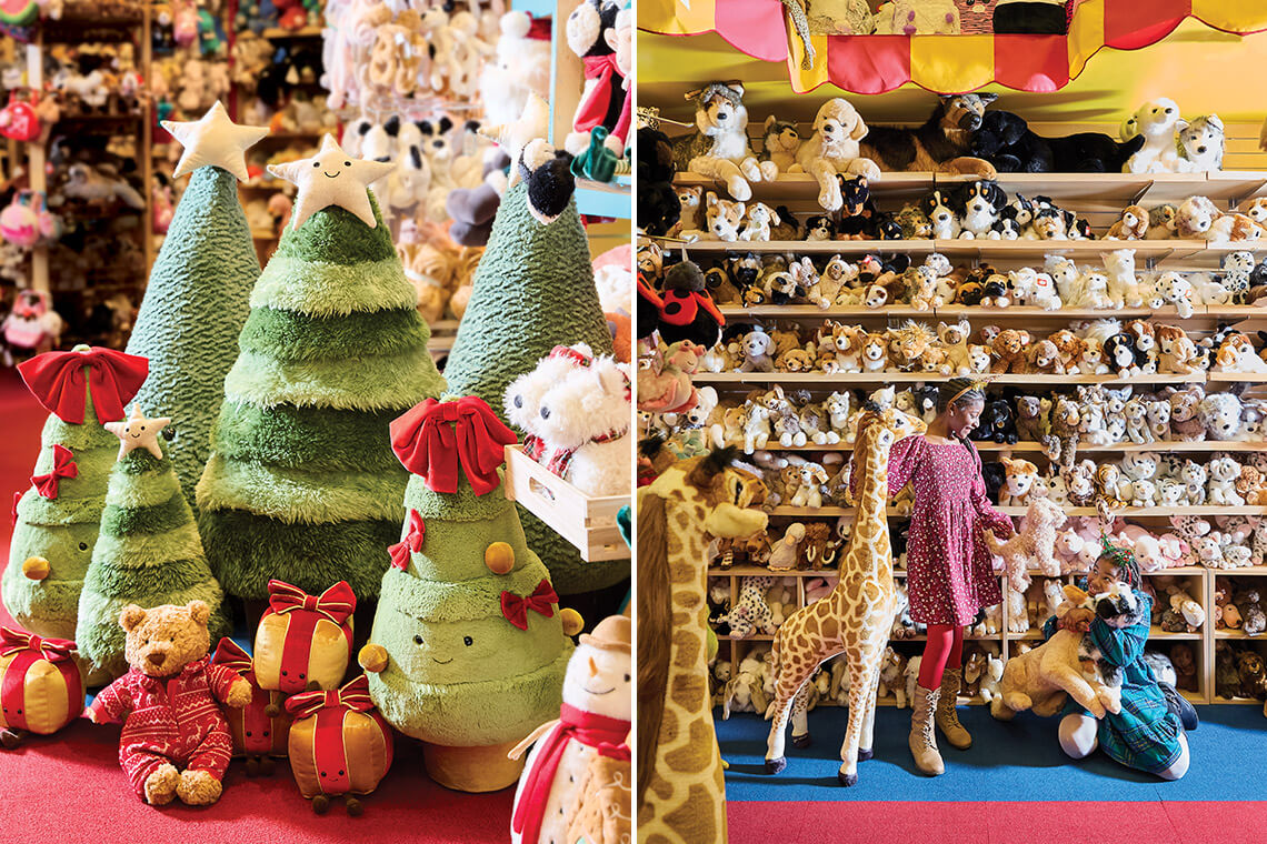 Two little girls snuggle the stuffed animals at Toys & Co.