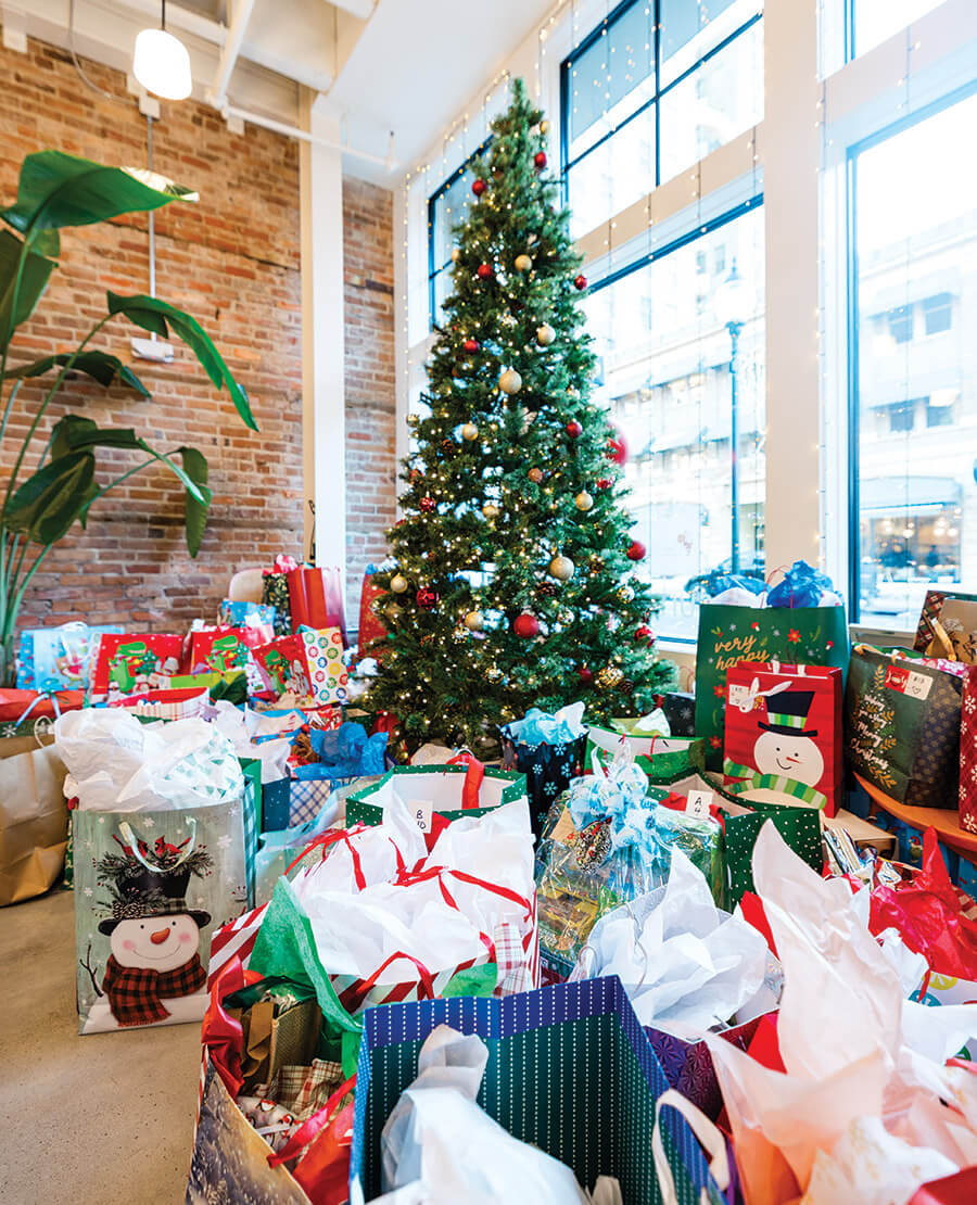 Christmas tree surrounded by presents for the Saint Nick's Wishlist