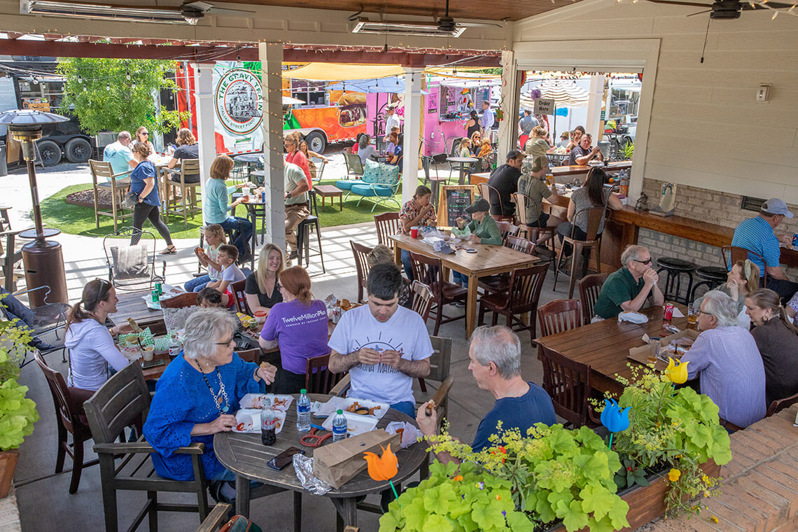 People on the patio at Red's Corner