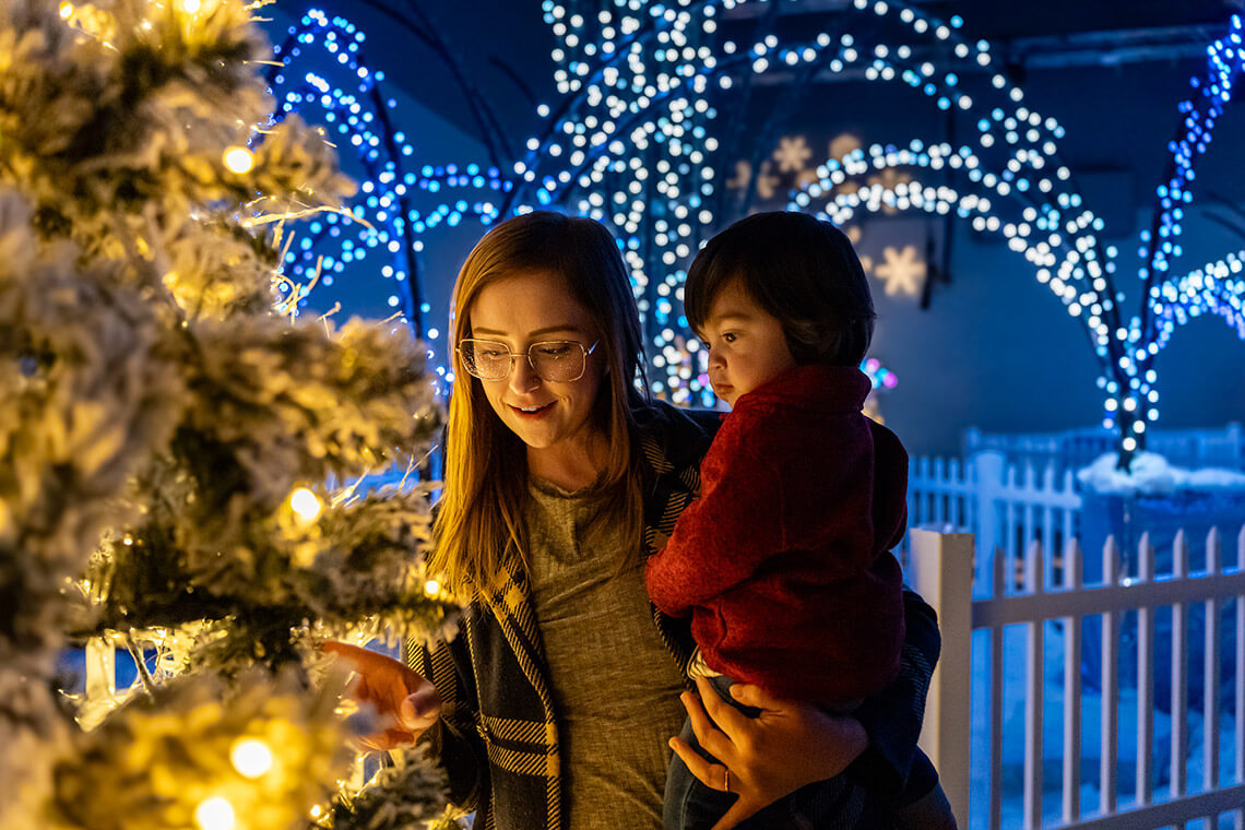 Mom and child look at lights at the Greensboro Science Center