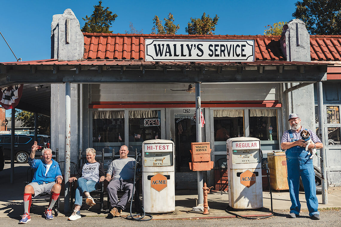 Mike's drivers and visitors sitting outside Wally's Service Station in Mount Airy