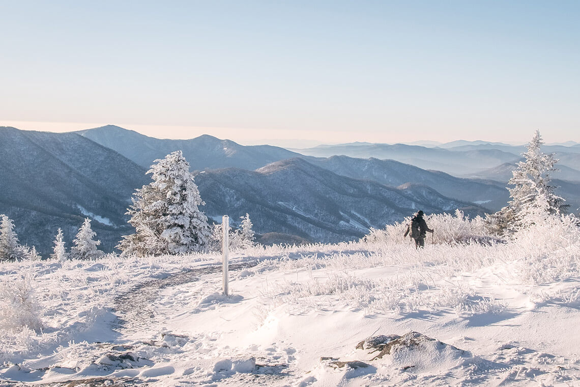 Hiker walks in the snow along the Appalachian Trail