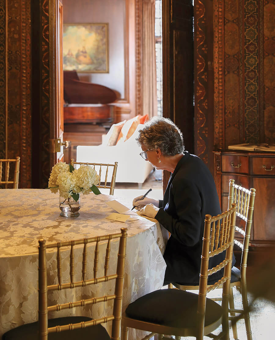 Kathleen Hutton writes a note to guests at Graylyn