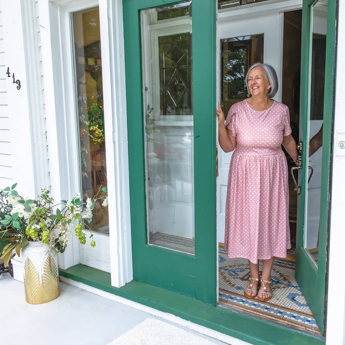 Lynn Dawson greets guests to The Royster House for tea