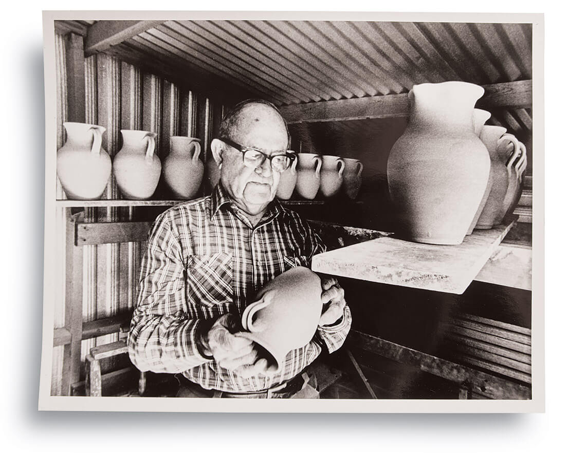 Black and white photo of C.B. "Charlie" Craven with jug pieces