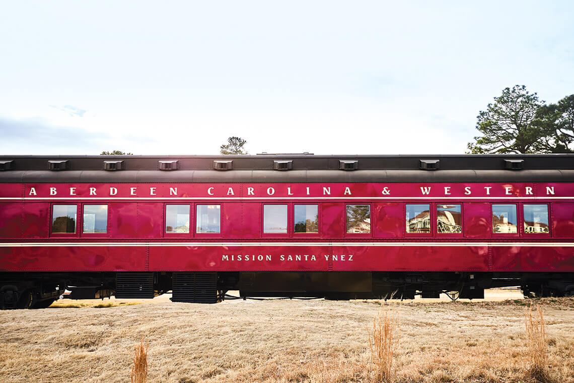 Exterior of The Mission Santa Ynez, one of the trains in Aberdeen, Carolina & Western Railway