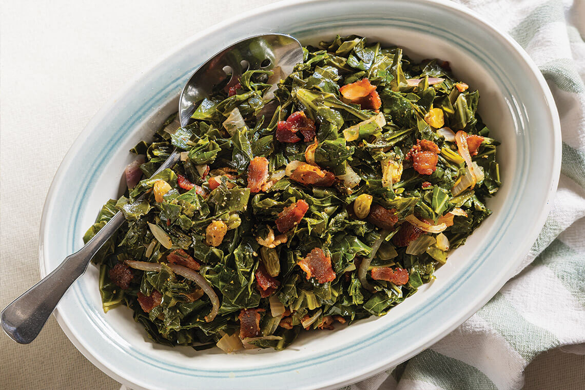 Serving dish of greens and bacon