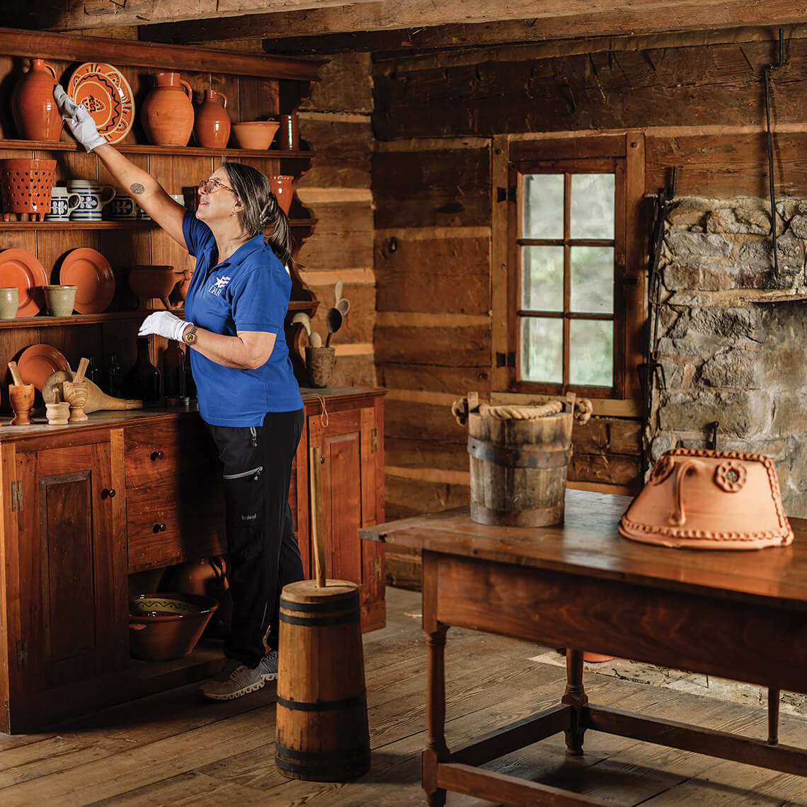 Shelly Kiker tends to the artifacts in the Rock House