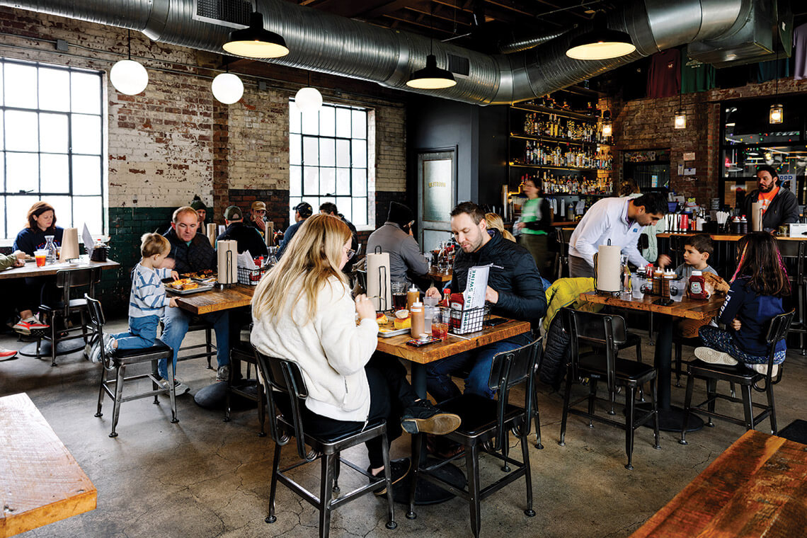 People eat in Longleaf Swine's dining room