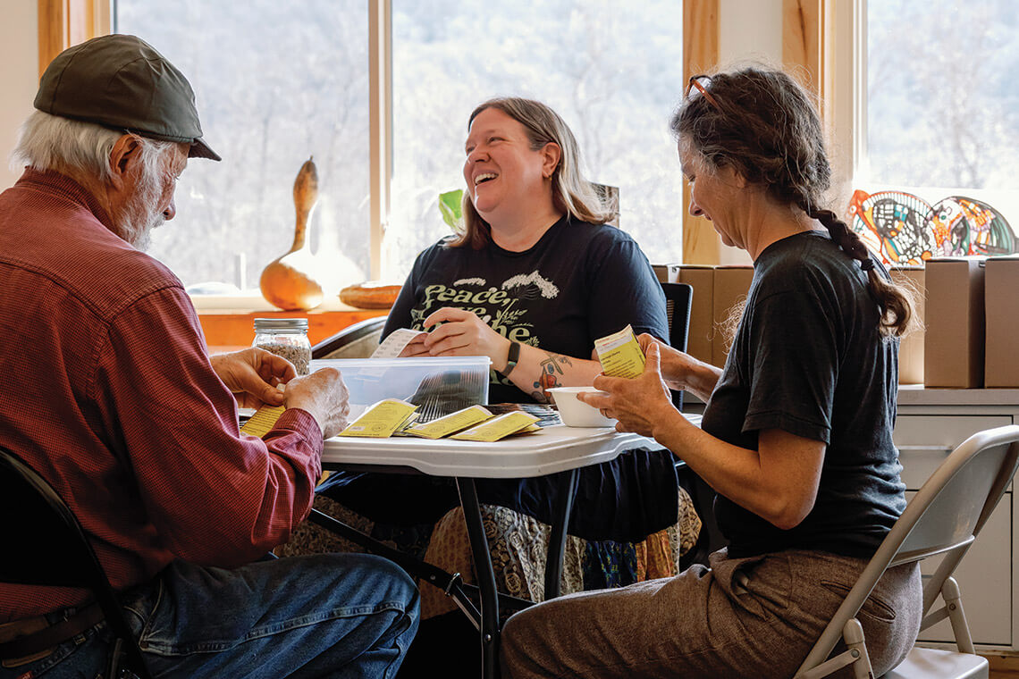 Members of the Appalachian Seed Growers Collective packing seeds