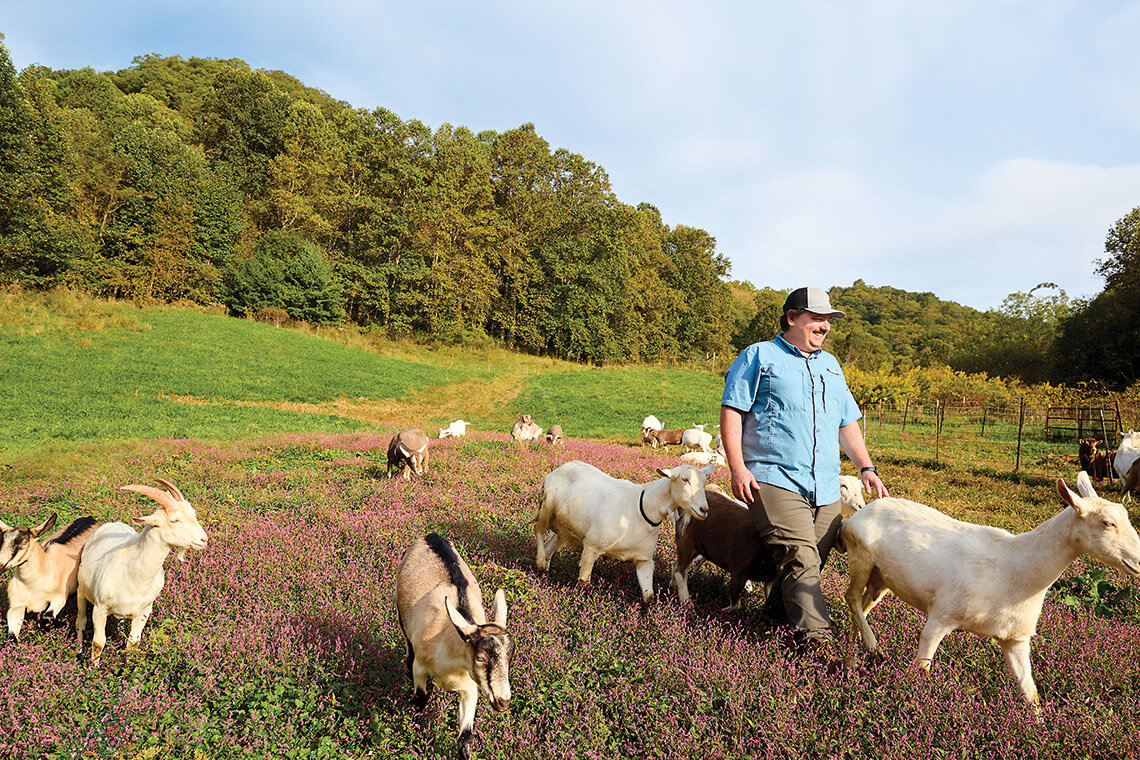 Cullen Owen and goats at Spinning Spider Creamery