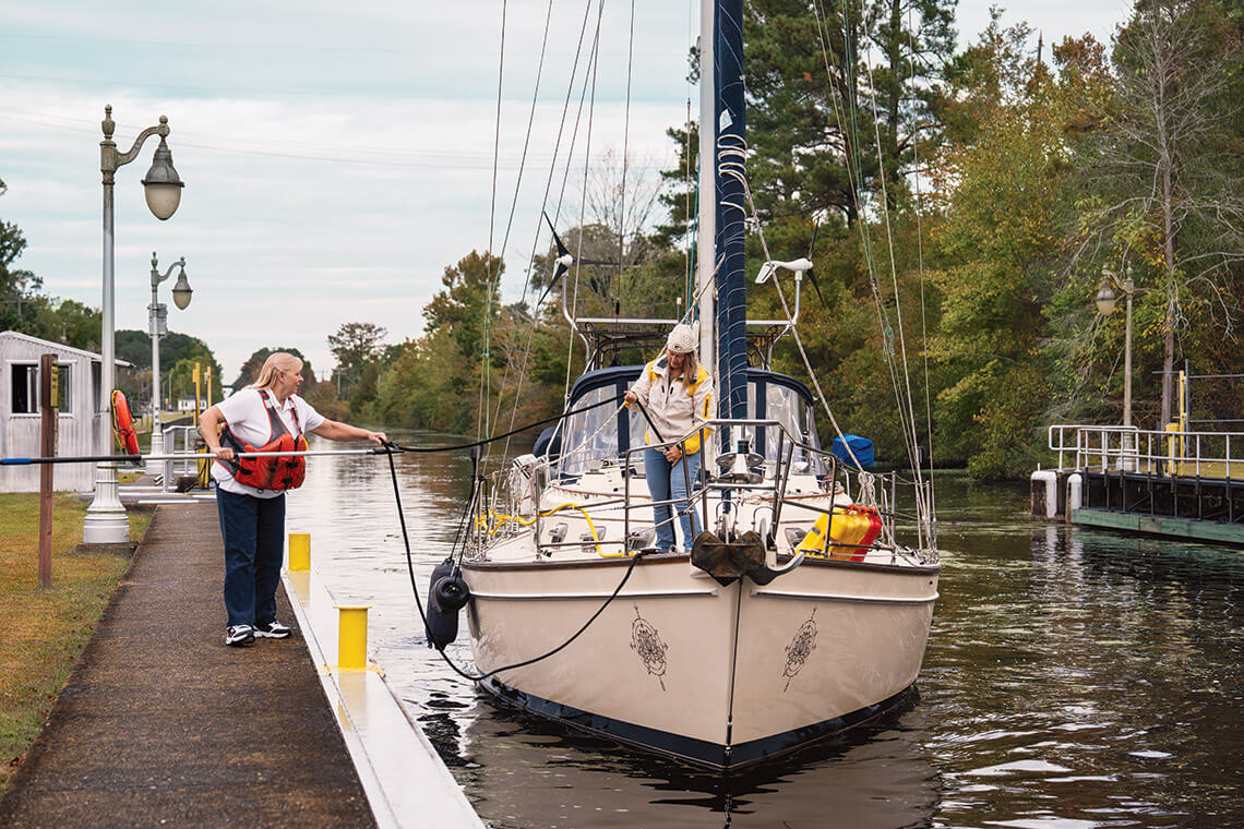 Tammy ties off arriving sailboat 