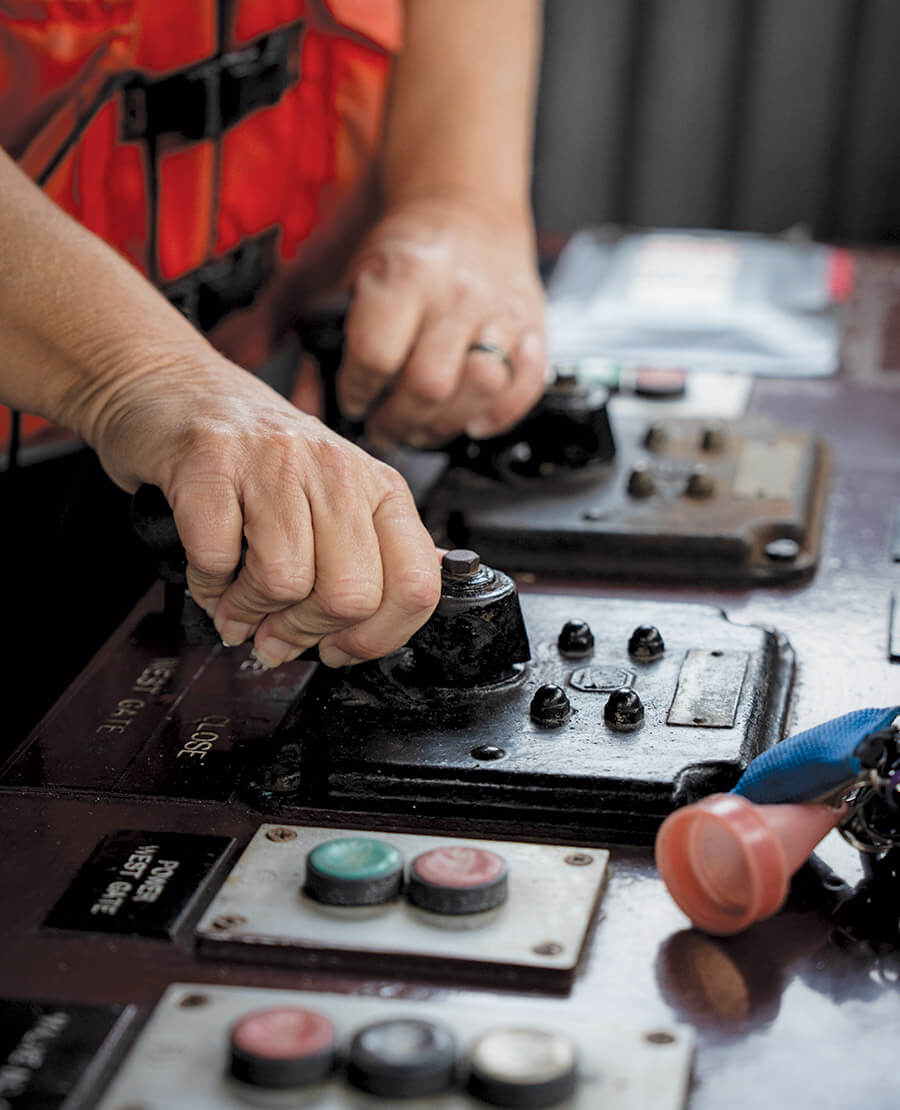 Tammy works the drawbridge at South Mills Lock