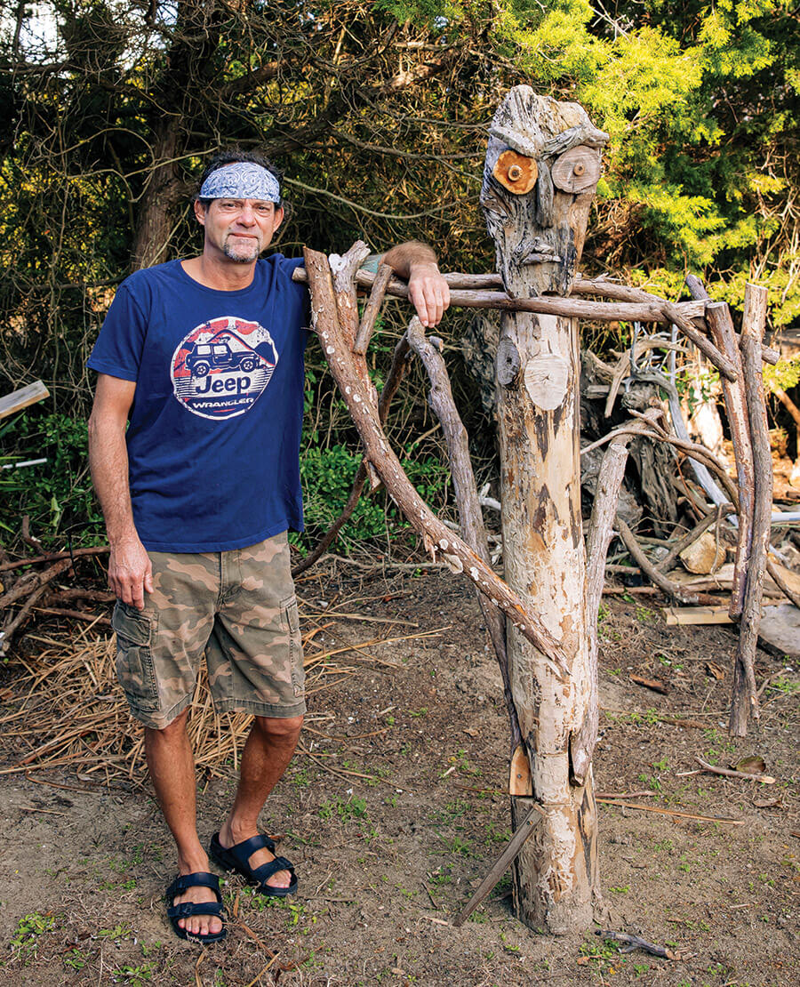 Dean Russell and his driftwood sculpture Murdoch