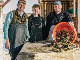 James, Charlie, and Jimmy Morris with a basket of oysters