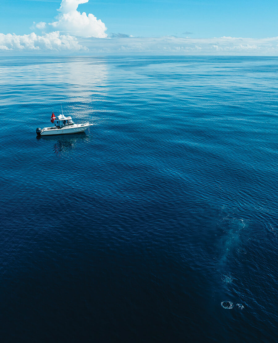 Sarah and James Doss on their boat in the ocean