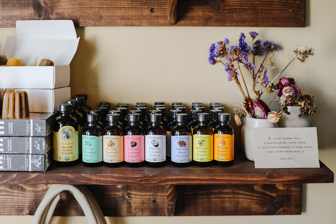Shelves with dried flowers and tinctures at The Nectary