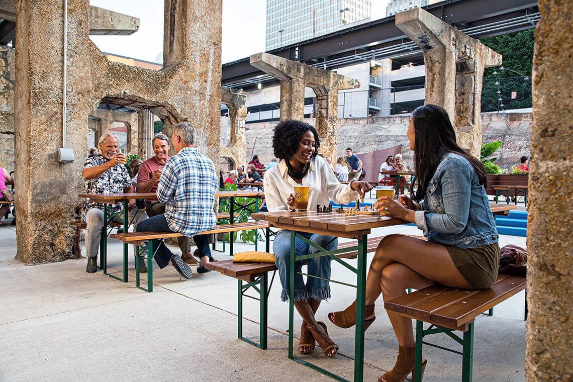 People at the outdoor seating area of a Winston-Salem brewery