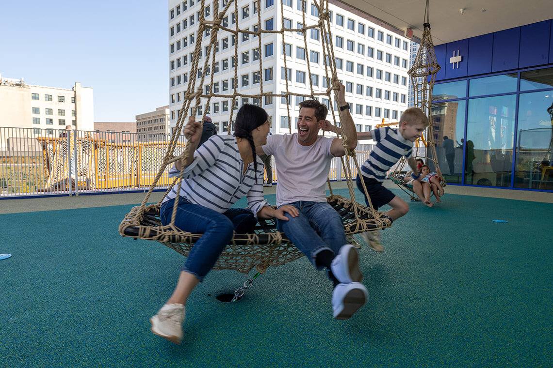 Family plays at the rooftop of Kaleideum