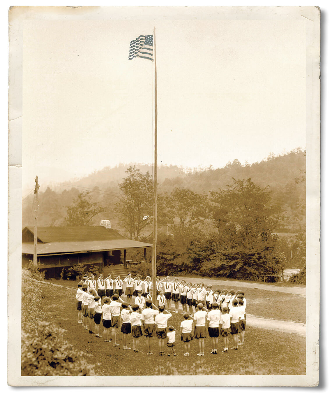 Campers start the day with flag-raising ceremony