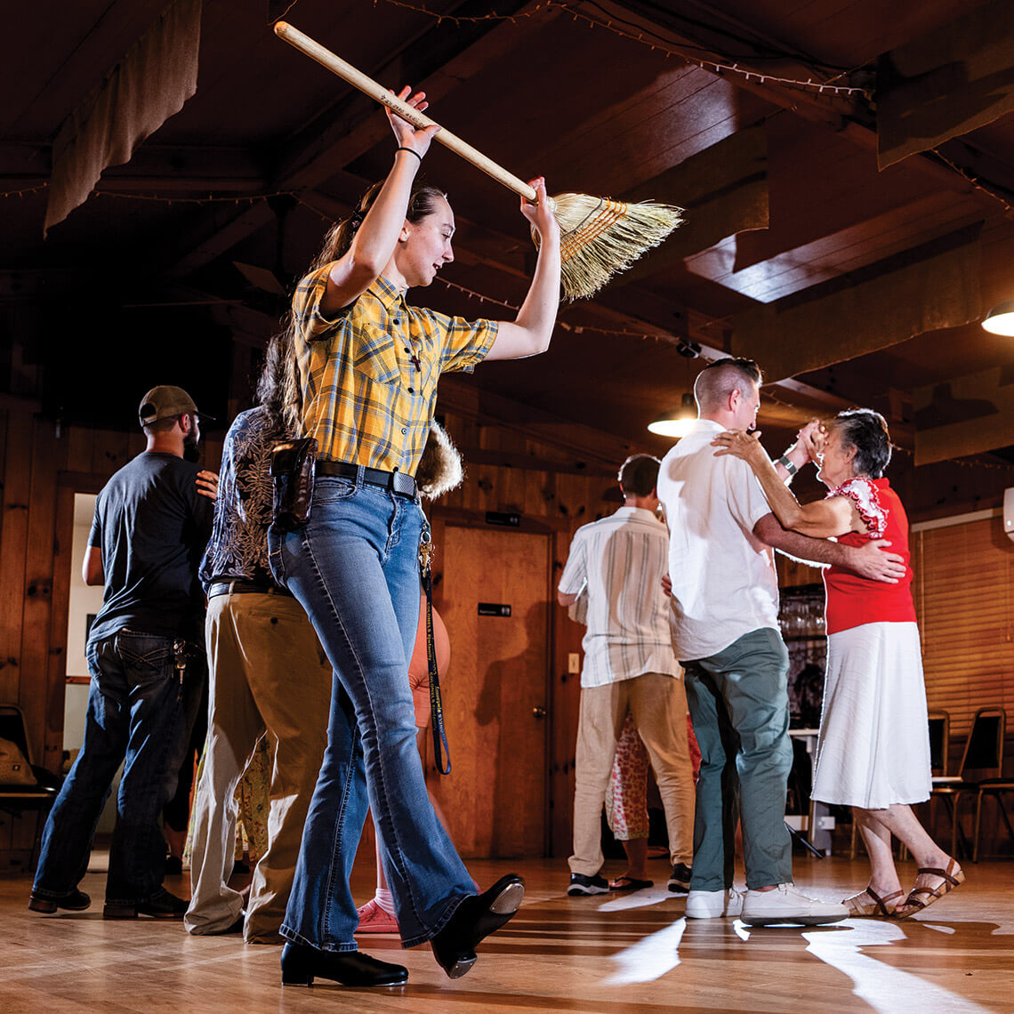 Daria Mann serves as a caller at the Geneva Hall square dance
