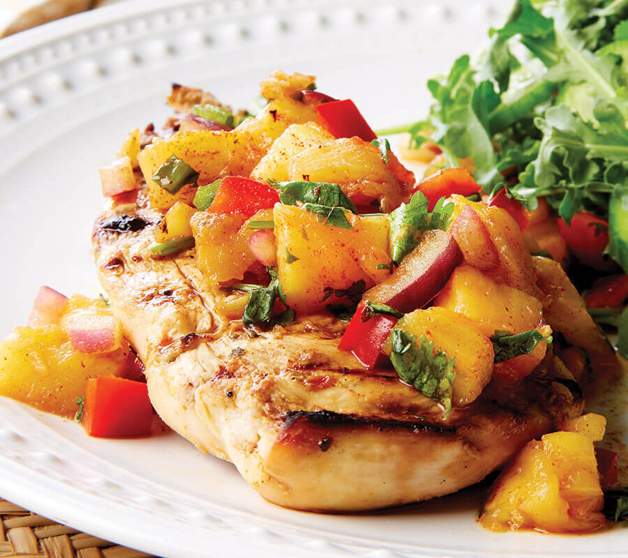 Fish topped with pineapple salsa