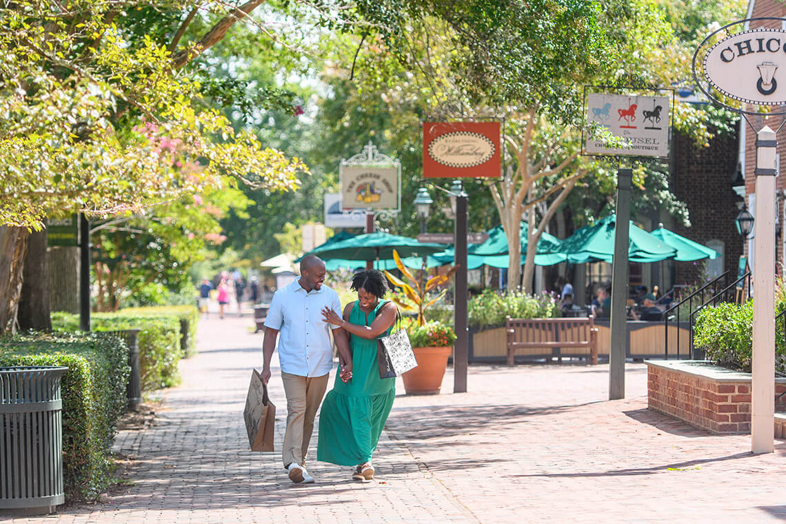 Couple walks through Merchants Square 