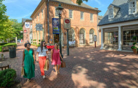 Family wanders through Williamsburg's Merchants Square