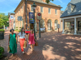 Family wanders through Williamsburg's Merchants Square
